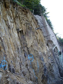 Rock structure exposed wall construction in background 